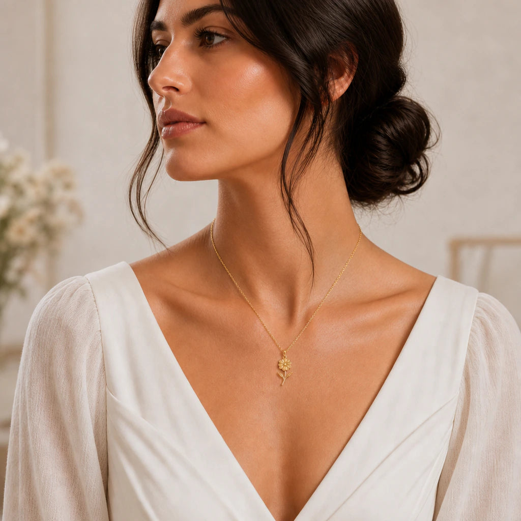 Primrose flower pendant necklace worn by a woman in white, natural lifestyle view