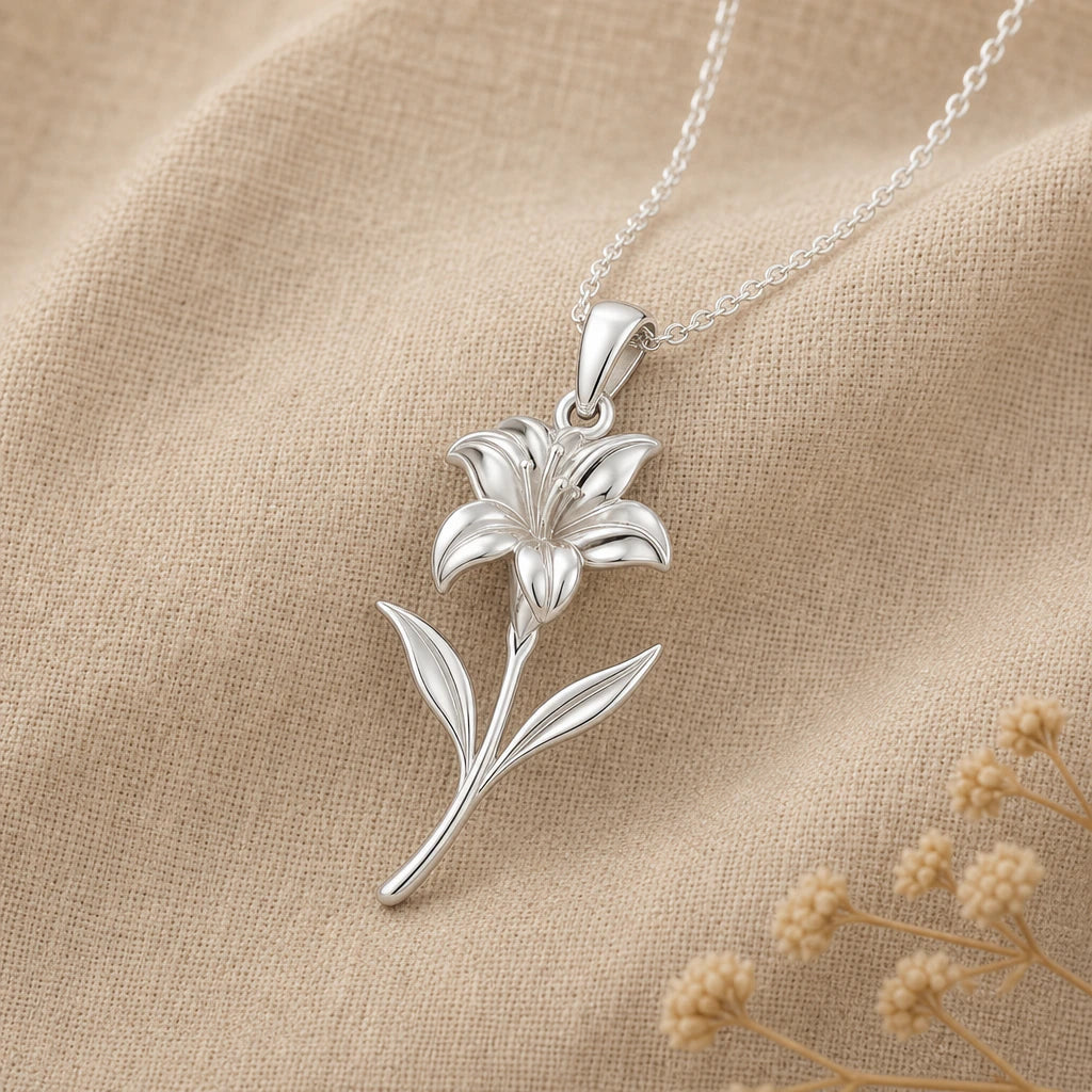 Canna flower pendant necklace in polished sterling silver on cream linen