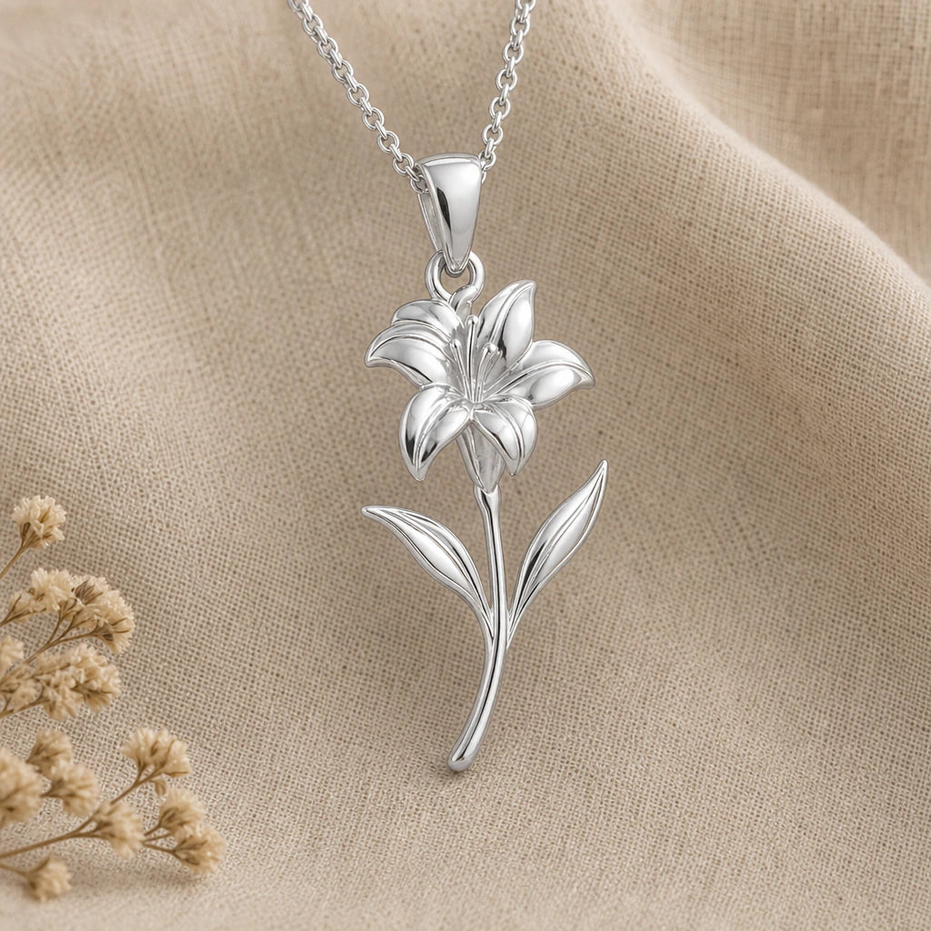 Close-up of Canna flower pendant necklace with sculpted petals, slender stem and two leaves in silver