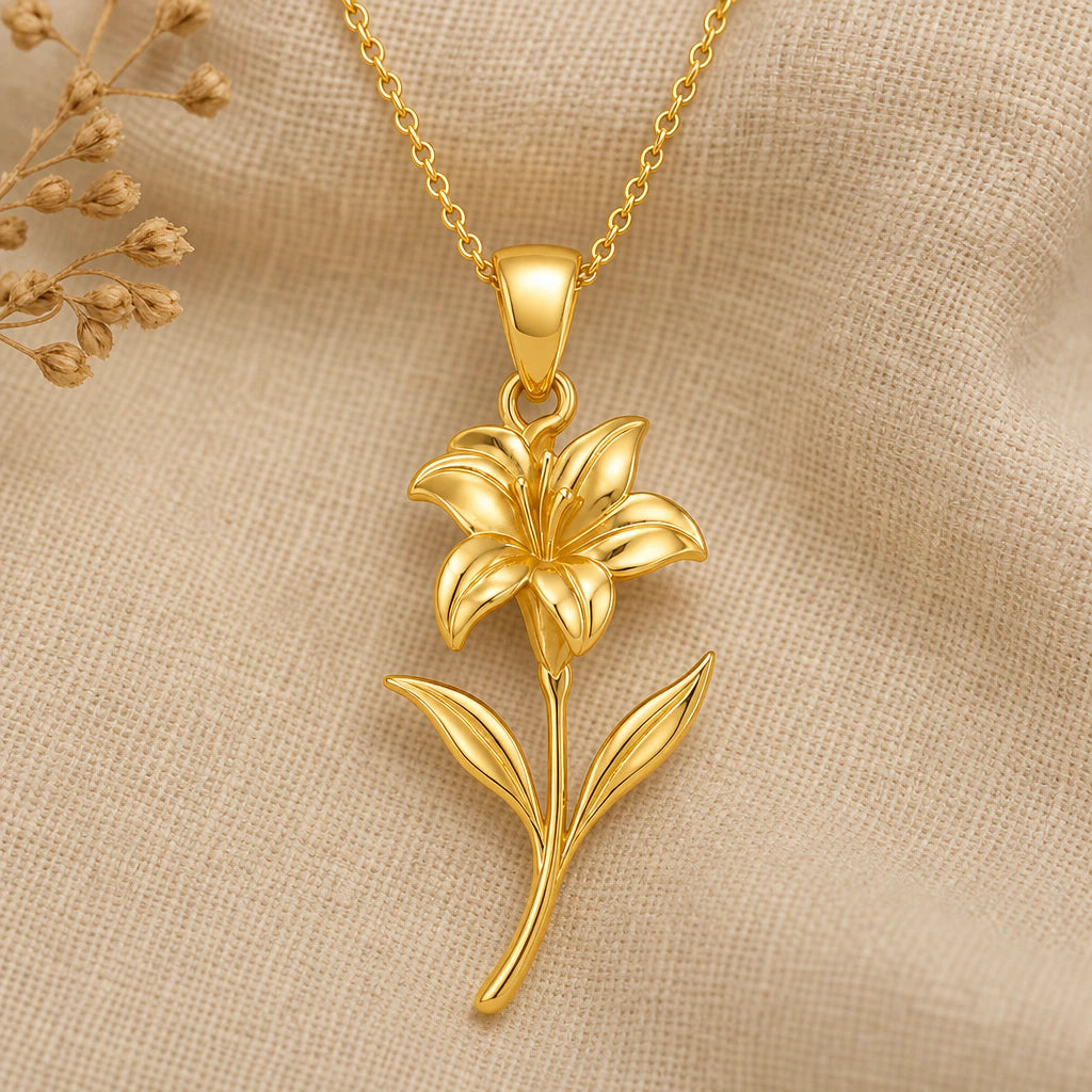 Canna flower pendant necklace in gold finish on soft cream fabric